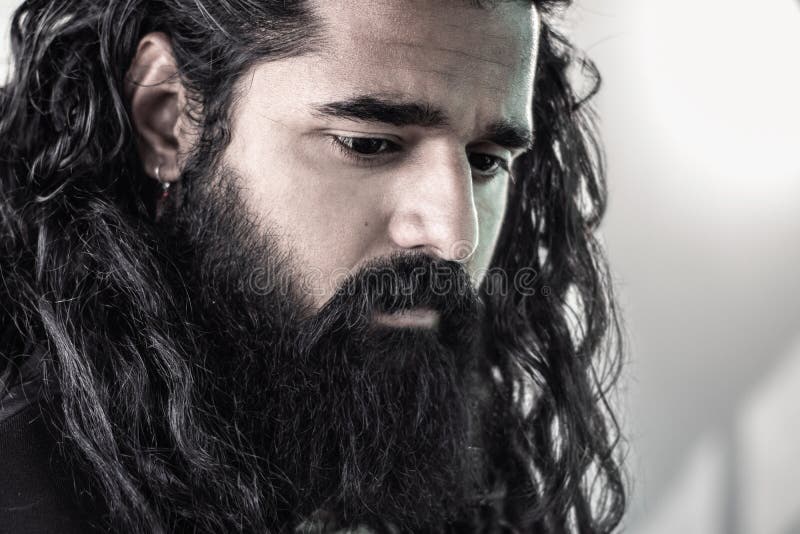 Close Up Side View of Bearded Man with Long Hair Posing in a Studio Whilst Looking Down Emotionally, Male Model Fashion Portrait Stock Image - Image of expression, indian: 183399127 Close Up Side View of Bearded Man with Long Hair Posing in a Studio Whilst Looking Down Emotionally, Male Model Fashion Portrait Stock Image - Image of expression, indian: 183399127