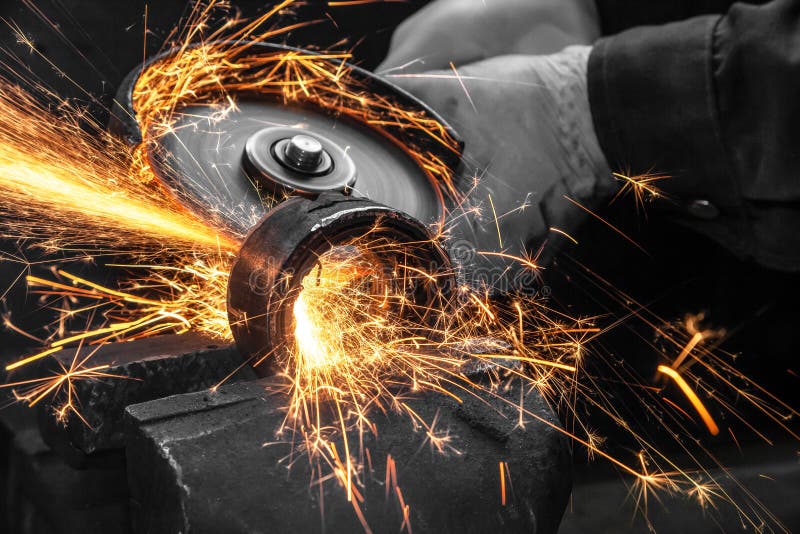 A close-up the welder cuts the metal stock photo A close-up the welder cuts the metal stock photo