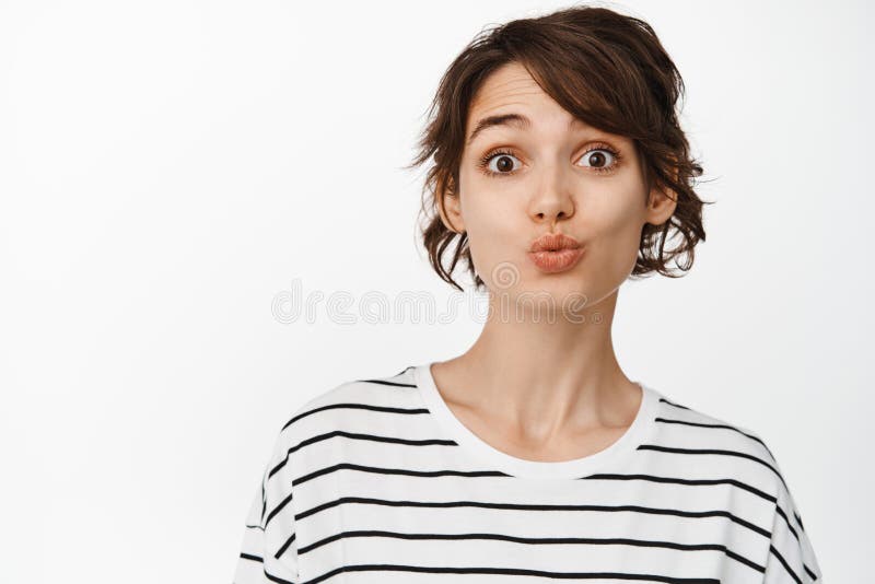 Close Up Of Silly And Cute Brunette Girl Pucker Lips Funny Kissing