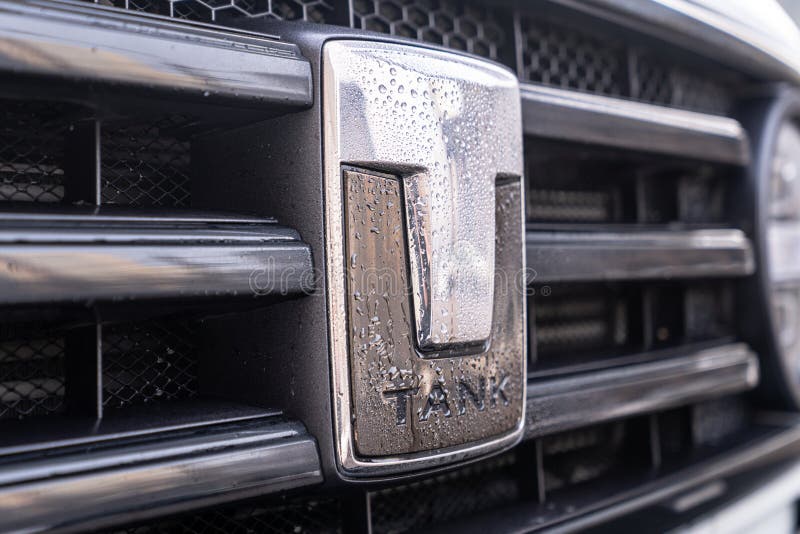 Close up of a sleek cars Tank emblem with water droplets, showcasing modern automotive design elements, A CloseUp of a stock images