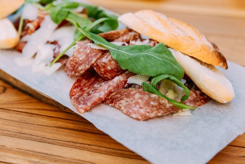 Closeup Sliced Salami Served with Bread, Cheese and Rocket Stock Image Image of breakfast