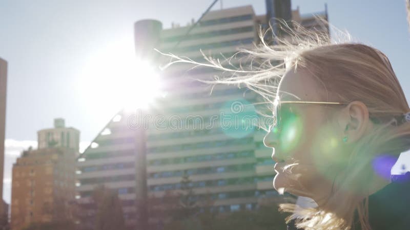 Blonde woman walking on the street