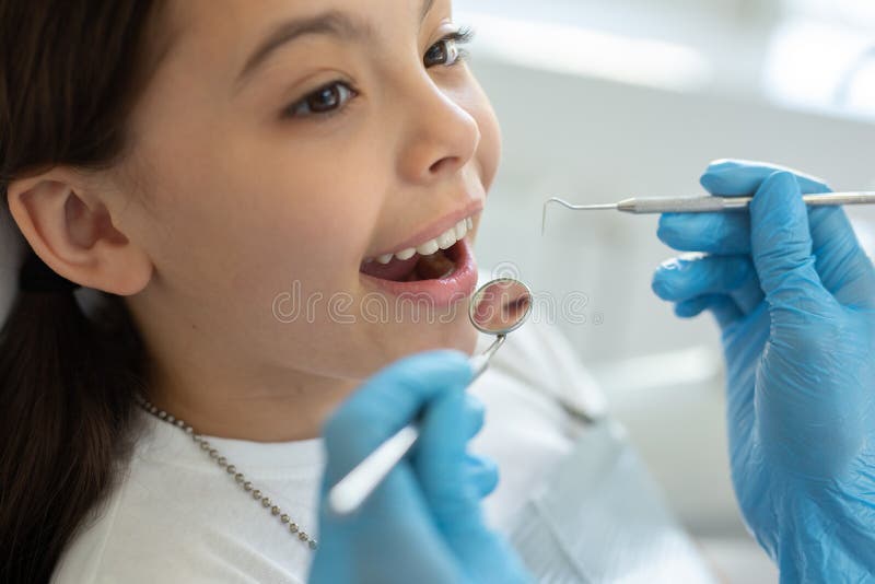 Close Up of Small Client at Dental Procedure, Dentist Using Dental