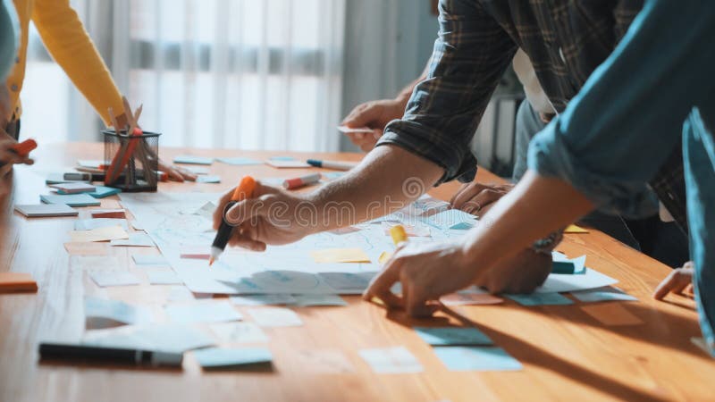 Close up of developer team using mind map to brainstorm idea. Top view of skilled group of business people working together writing marketing strategy by using markers and sticky notes. Symposium. Design mind map stock images, royalty-free photos and pictures