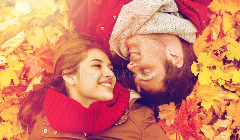 Close Up Of Smiling Couple Lying On Autumn Leaves Stock Image Image Of Happiness Couple 98155841