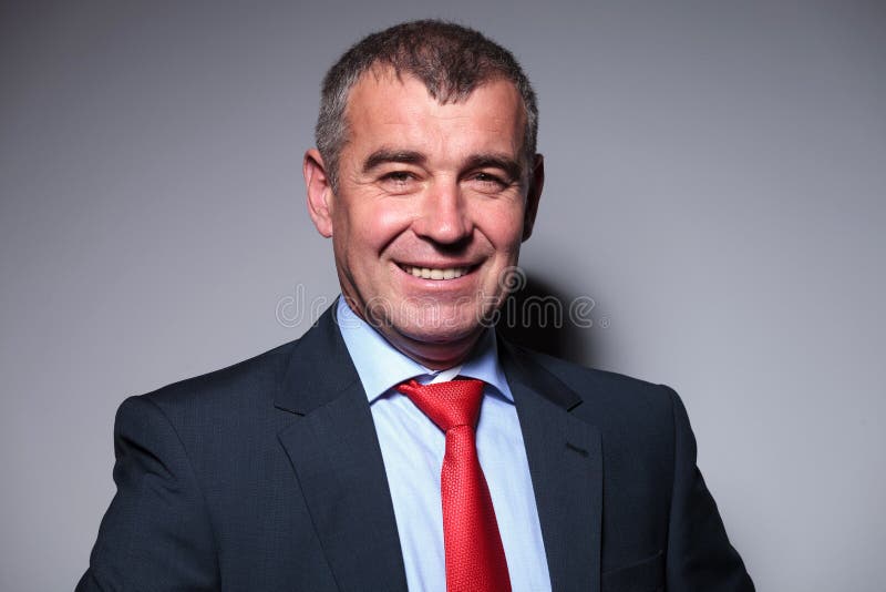 Close up of a smiling middle aged business man royalty free stock image