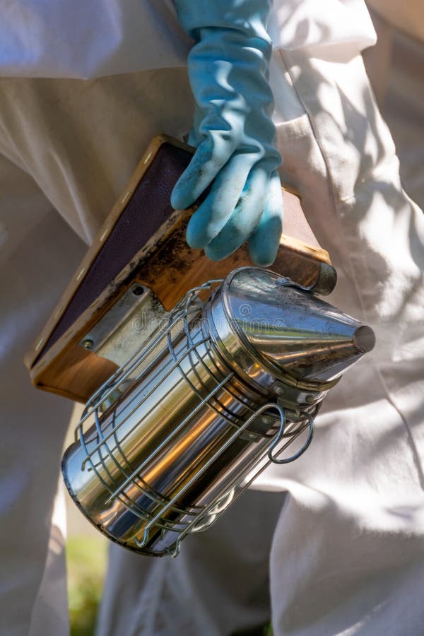Close-up of a smoker held by a beekeeper in an apiary stock photos