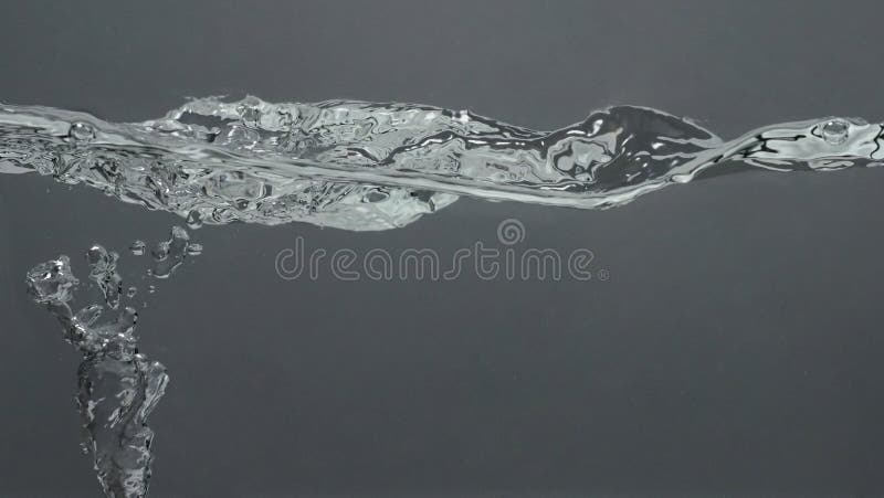 Close up soda water bubbles floating up to top of water surface royalty free stock image