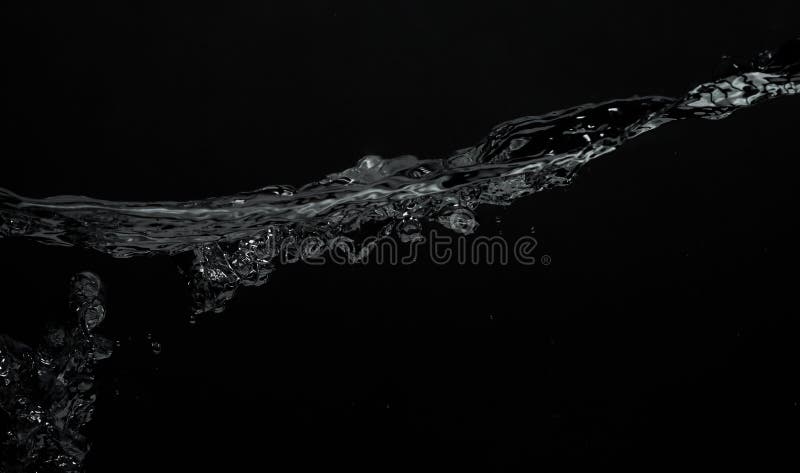 Close up soda water bubbles floating up to top of water surface royalty free stock images