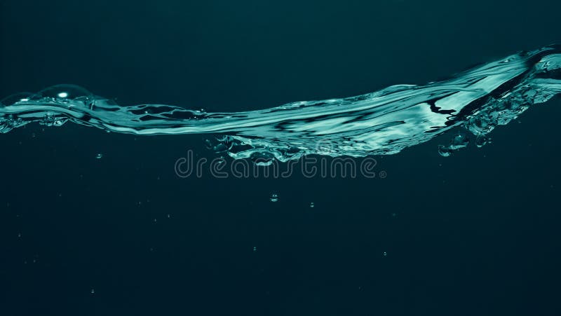 Close up soda water bubbles floating up to top of water surface stock photos