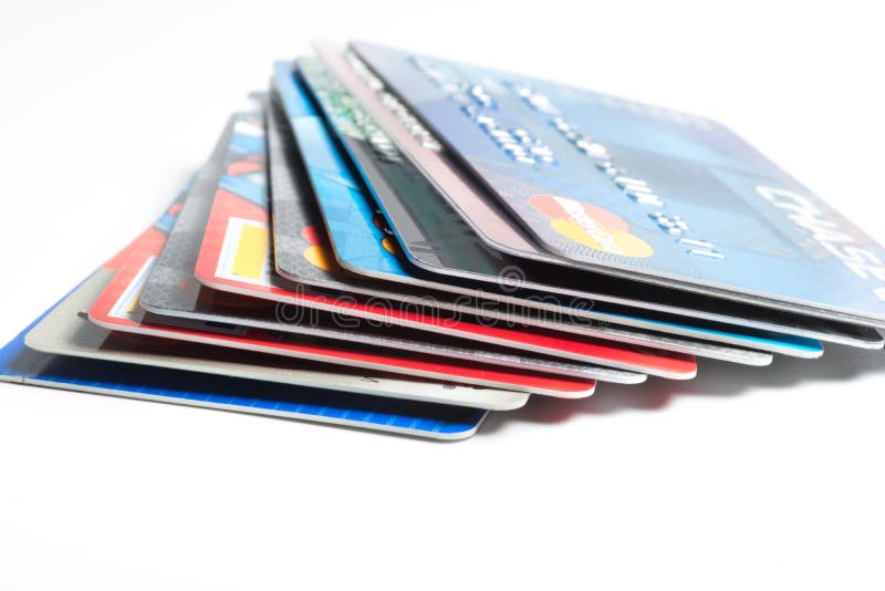 Close up of stack of credit cards on white background,illustrative editorial stock photography