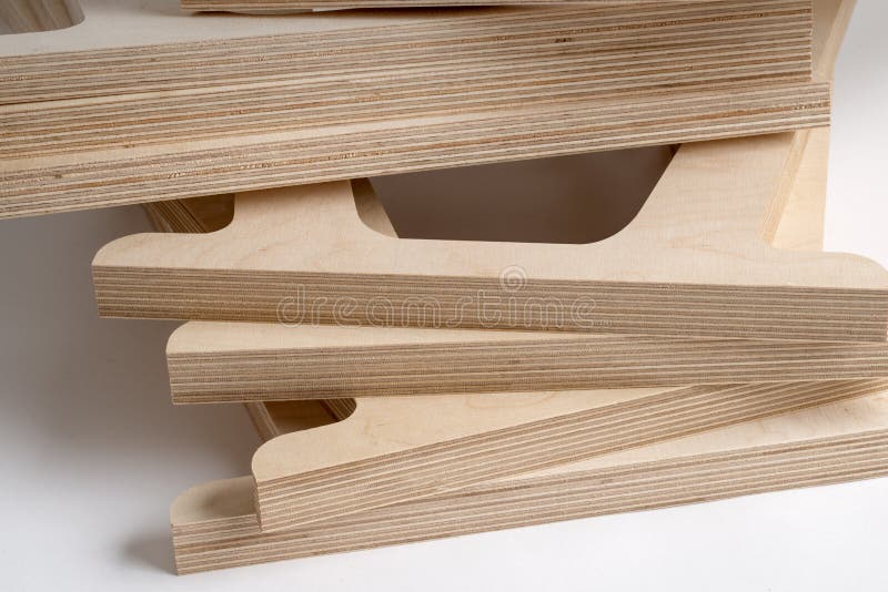 Table Legs Made of Plywood of Various Sizes on Gray Background Stock