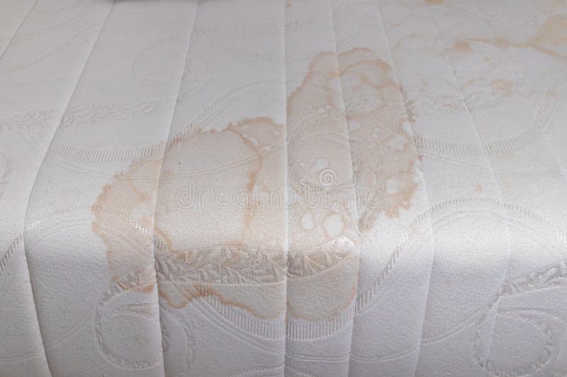 dirty mattress topper close up stains discoloration