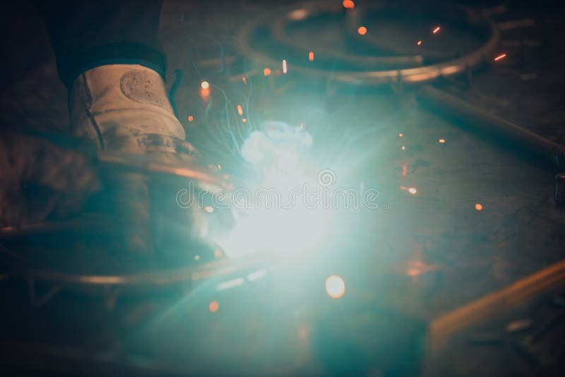 Close Up of the Steel Welding Process. Work in the Heavy Steel Industry