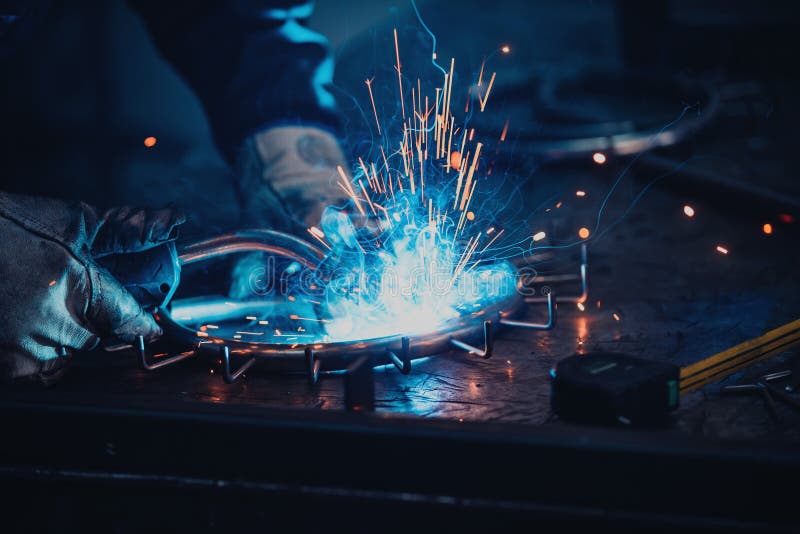 Close Up of the Steel Welding Process. Work in the Heavy Steel Industry