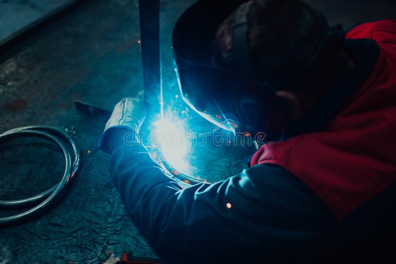 Close Up of the Steel Welding Process. Work in the Heavy Steel Industry
