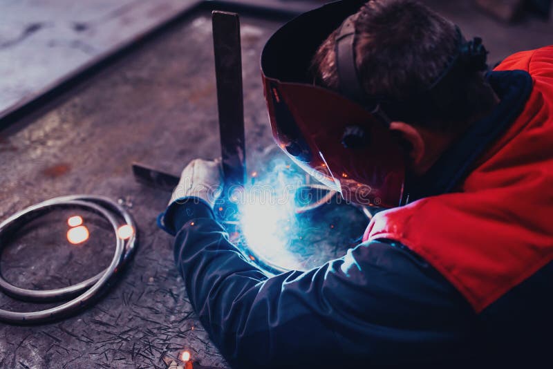 Close Up of the Steel Welding Process. Work in the Heavy Steel Industry