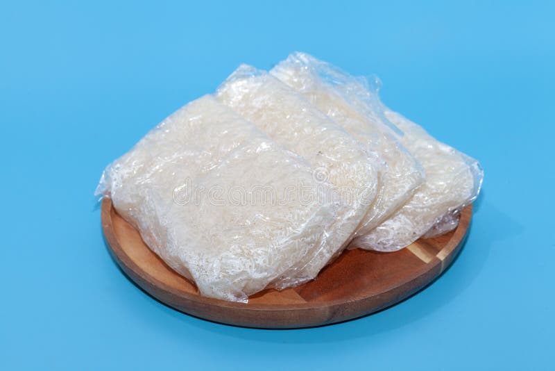 Sticky Rice in Plastic Bag in Thai Style on Blue Background Stock Photo
