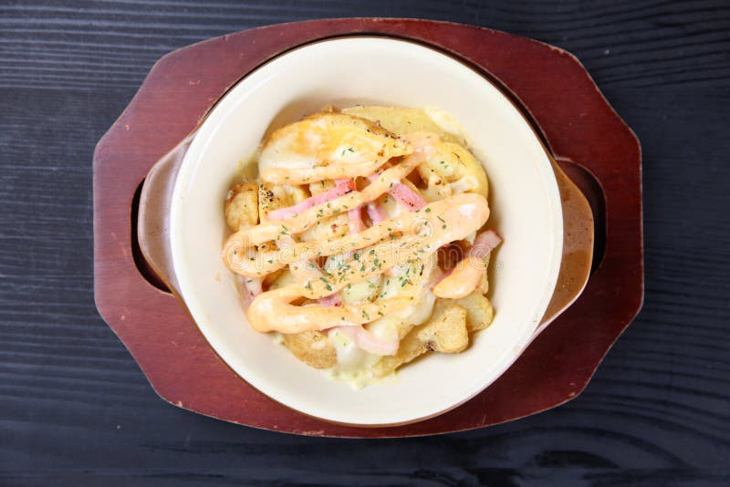 Close up studio shot of Cheesy potato bake royalty free stock photos