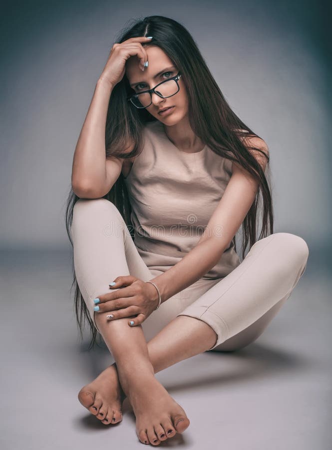 Close Up. Stylish Young Woman Sitting on the Floor. Stock Photo - Image