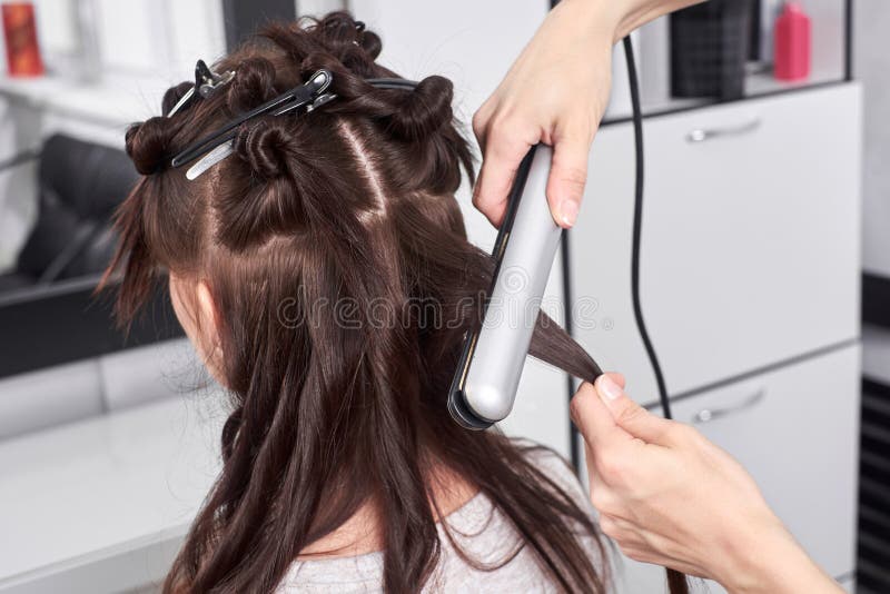 Close Up of Stylist`s Hand Using Curling Iron for Hair Curls Stock Photo Image of parlor