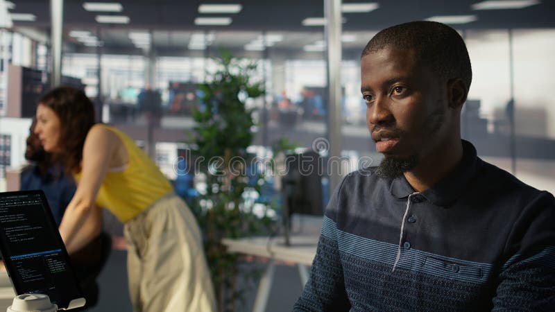 Close up of system administrator doing software quality assurance with tablet stock image