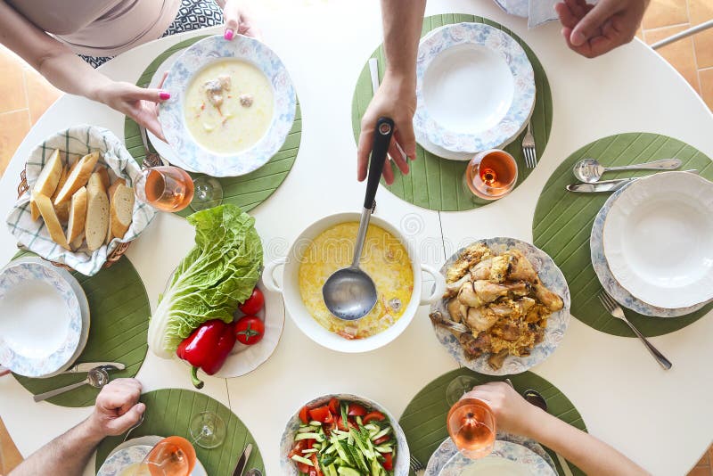 Close up of the table fish soup, salad and chicken. stock photography Close up of the table fish soup, salad and chicken. stock photography