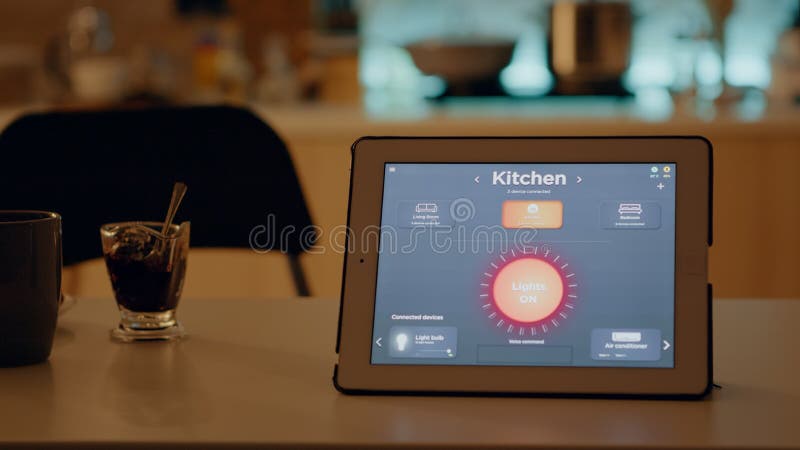 Close up of tablet with wireless lighting automation software placed on table stock image