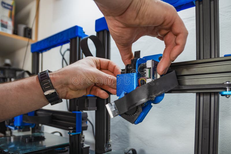Close-up of technician doing 3D printer repair stock photos