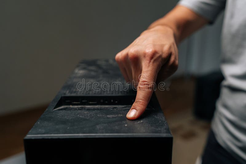 Close-up of technician finger indicating dust buildup on computer case surface, highlighting critical need for royalty free stock images
