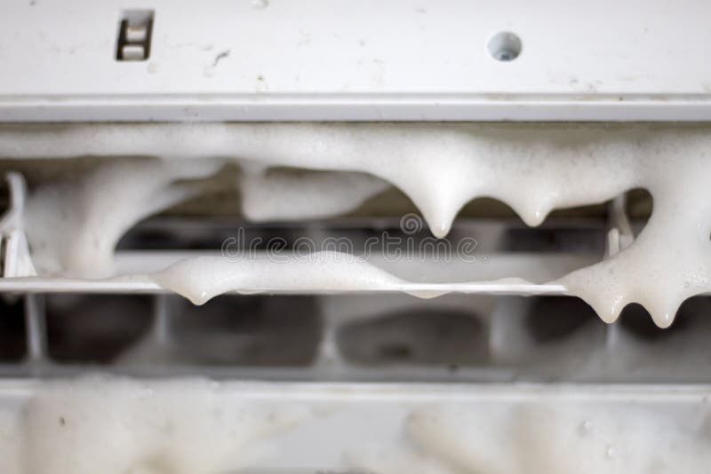 Close Up Technician Service Using Vacuum Cleaner To Cleaning the Air Conditioner Stock Image