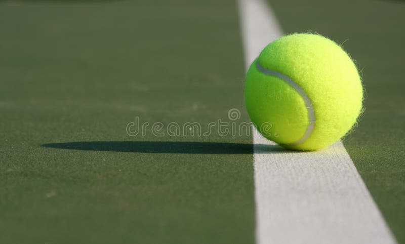 Close up of a tennis ball on the court