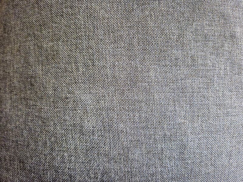 Close-up of textured fabric in gray tones, ideal for backgrounds or design projects. stock photo