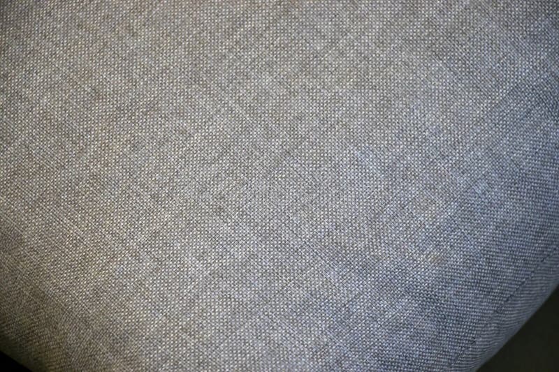 Close-up of a textured gray fabric, ideal for design and textile applications. Subtle weave creates a sophisticated atmo royalty free stock photo