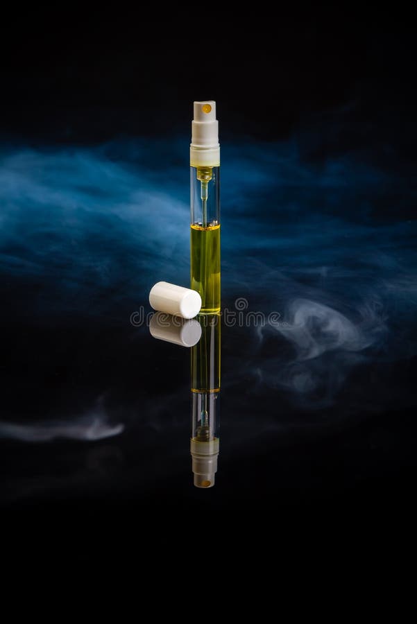 Close Up Thin Bottle of Yellow Perfume Sample. Stock Image Image of