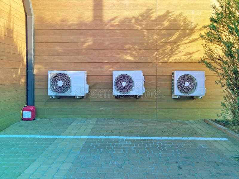 Closeup of Three Air Conditioner Outdoor Units. Three Air Conditioners