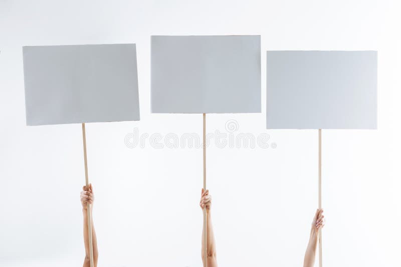 Close up of three protest signs