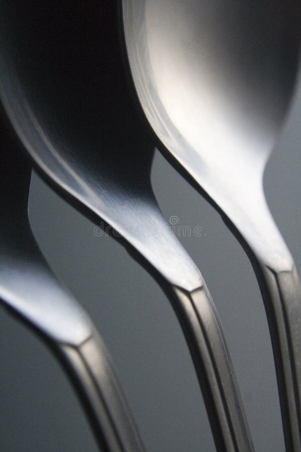CLOSE UP OF THREE SPOONS