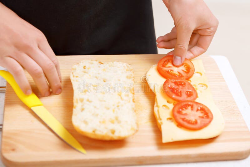 Close up of tomatoes put on bread