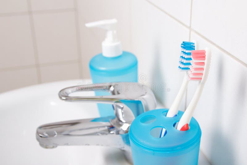 Close Up of Tooth Brushes on White Sink Stock Image Image of