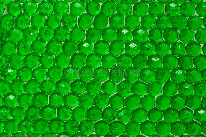 Close Up of Translucent Green Crystals. Green Beads Glittering and