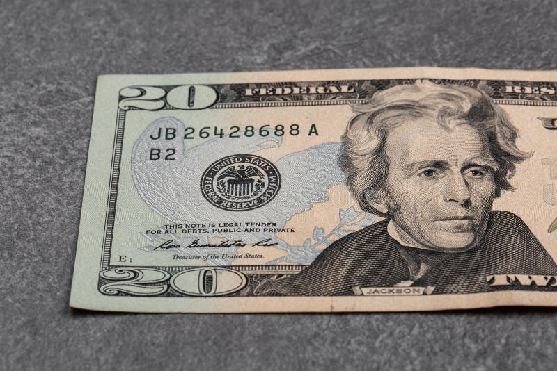 Close up of twenty dollar isolate on grey background. Horisontal photo