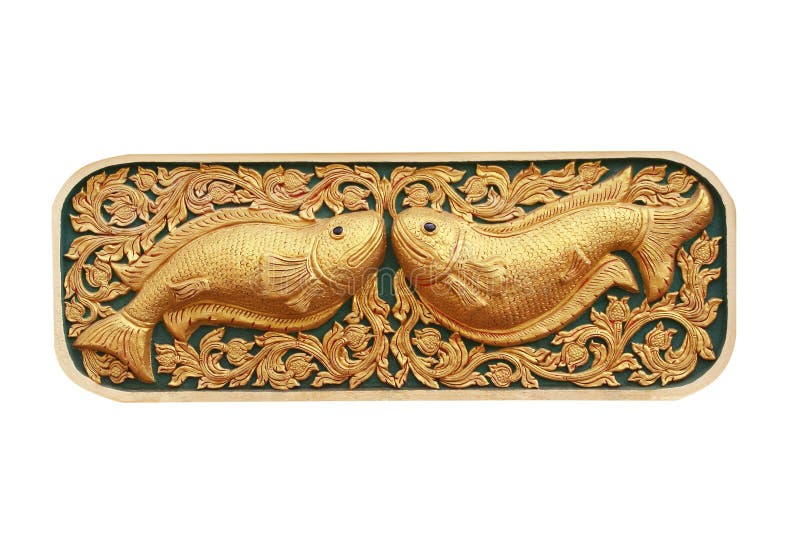 Twin golden fish,traditional thai stucco pattern with carving in temple,Chiang Mai,Thailand isolated on white background stock image Twin golden fish,traditional thai stucco pattern with carving in temple,Chiang Mai,Thailand isolated on white background stock image