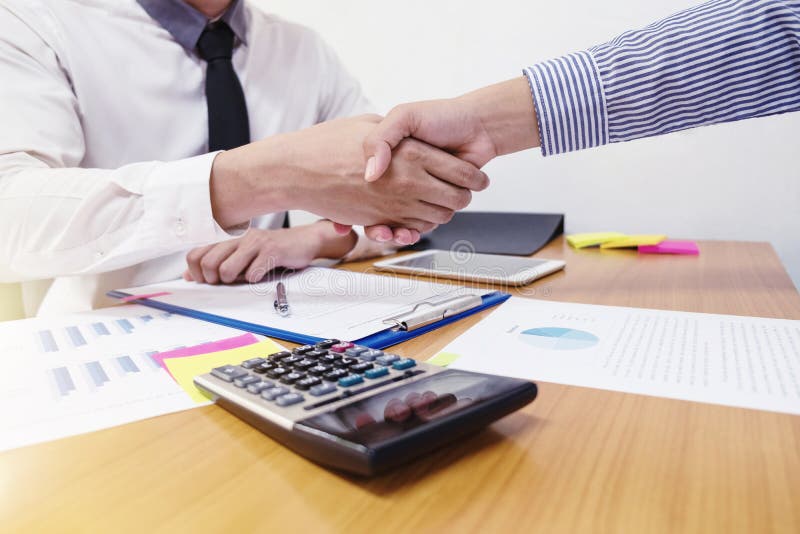 Close-up of two business people shaking hands