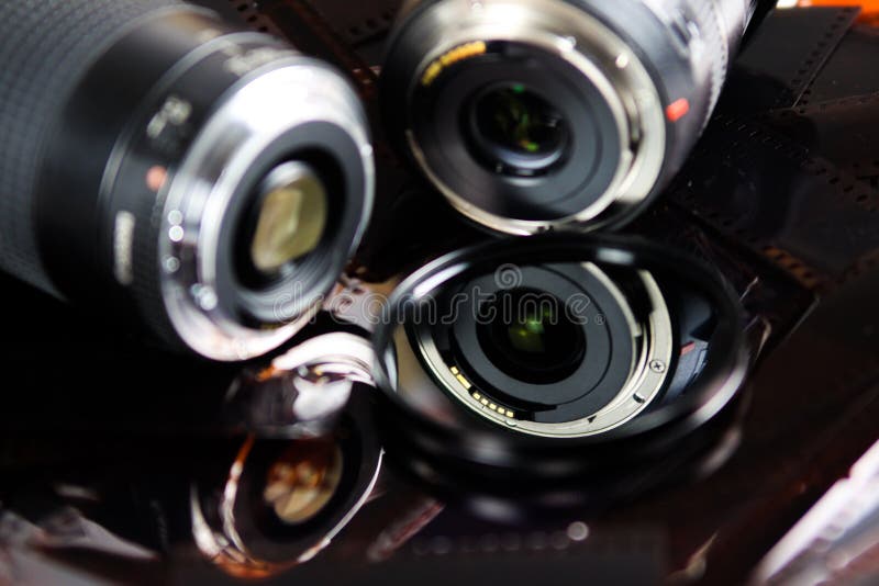 Close Up of Two Camera Lenses with Isolated Circular Filter on Negative