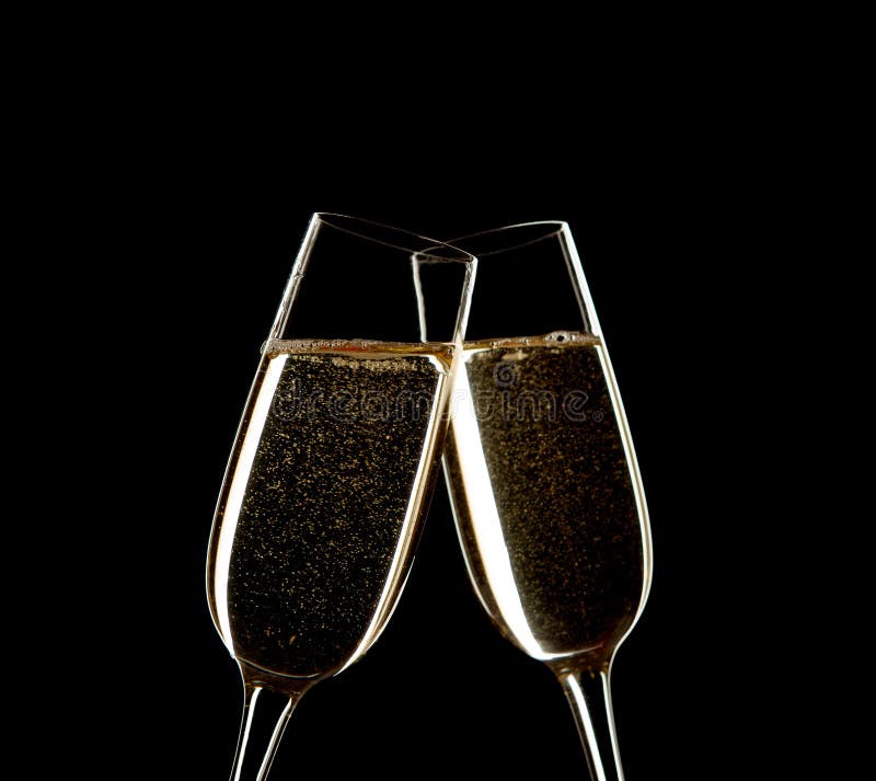 Close up of two glasses of Champagne clinking together isolated on black.