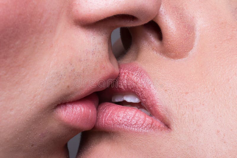 Close-up two lips kissing sensual intimate