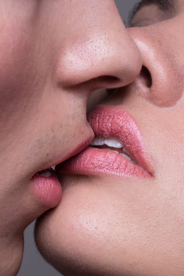 Close-up two lips kissing sensual intimate