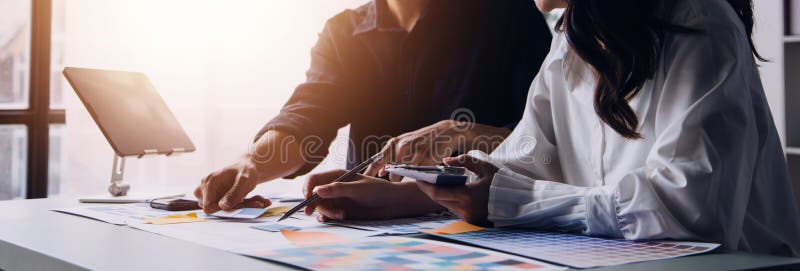 Close up ux developer and ui designer brainstorming about mobile app interface wireframe design on table with customer breif and royalty free stock images