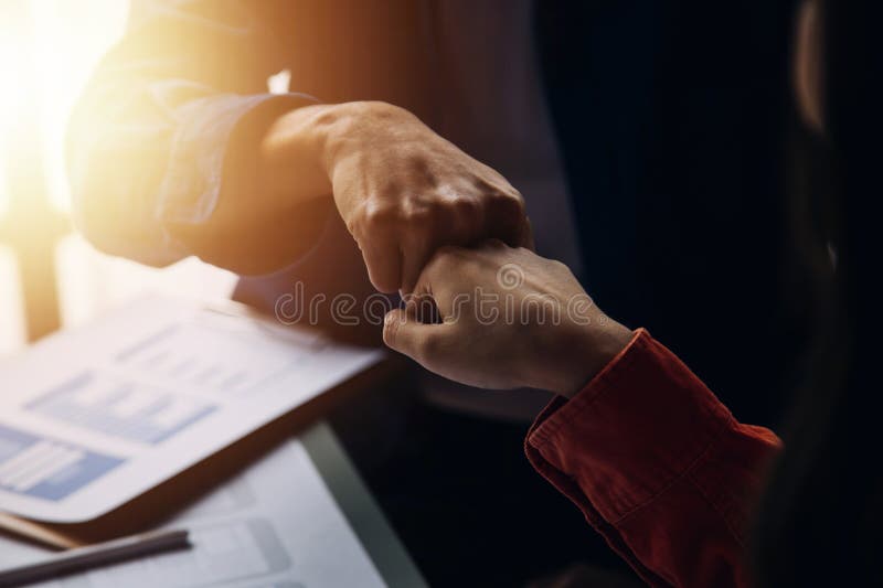 Close up ux developer and ui designer brainstorming about mobile app interface wireframe design on table with customer breif and stock photo